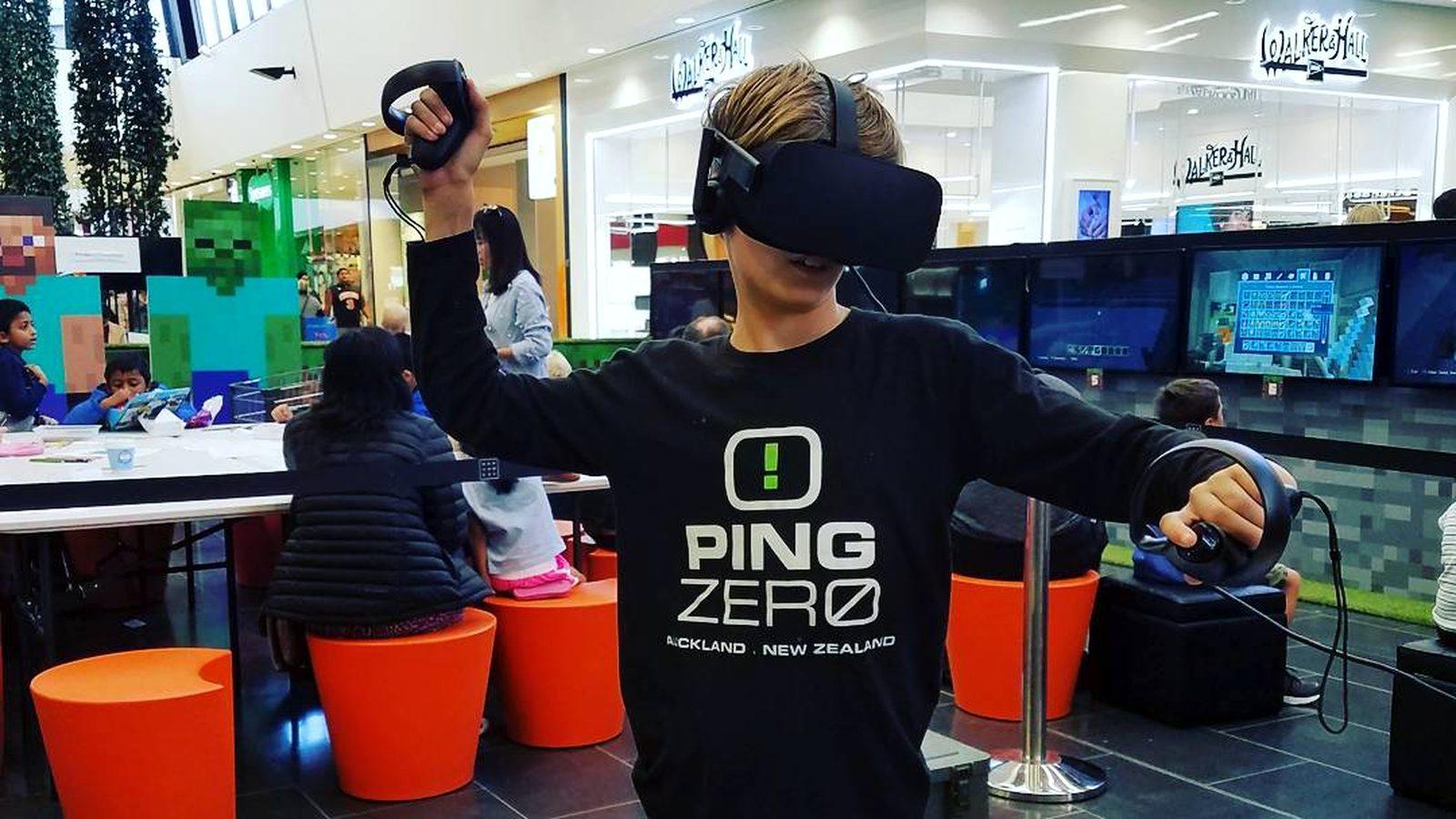 A kid playing VR at a Ping Zero event